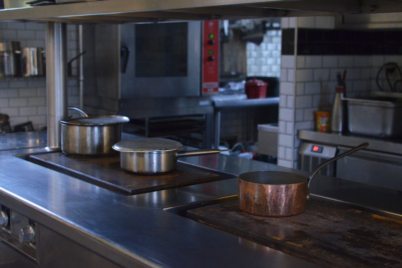 Commercial kitchen in a Tampa restaurant being inspected for cockroaches
