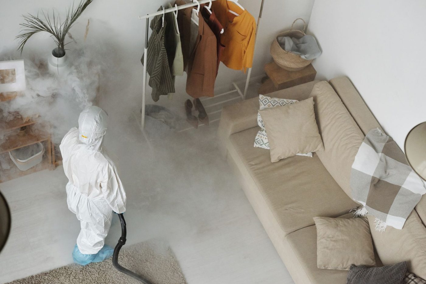 Pest control treatment being applied inside a Tampa home for cockroaches